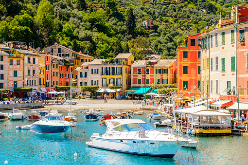 PORTOFINO, ITALY - MAY 4, 2016: Picturesque harbor of Portofino, an Italian fishing village, Genoa province, Italy. A vacation resort with celebrity and artistic visitors.