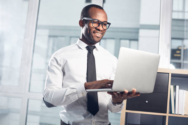 istock Cheerful qualified businessman is enjoying his work 891021470