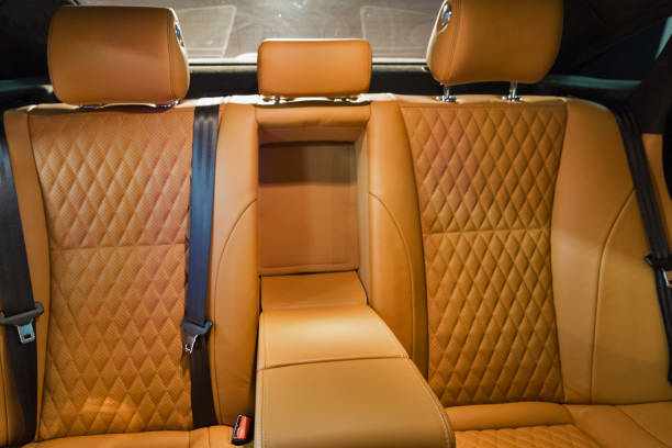leather interior of a luxury modern car closeup. back passengers seats.