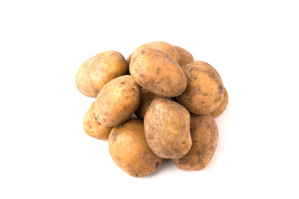 istock Pile of raw potatoes on a white background 891036022