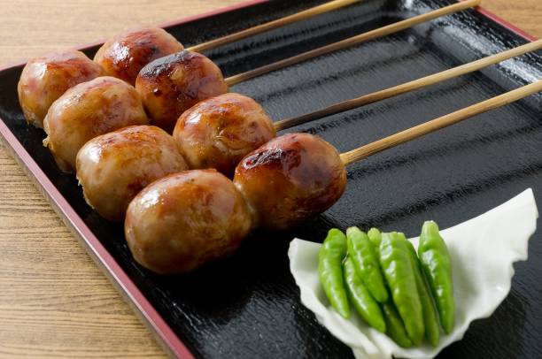 istock Thai Grilled Sausages on A Black Tray 891040884