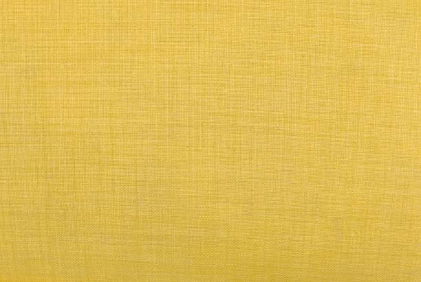 istock Close Up Background of Yellow Textile Texture 891041504