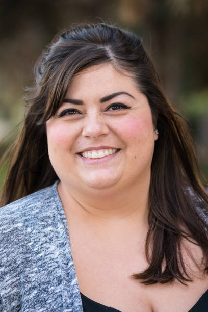 istock Smiling mid adult woman 891042318