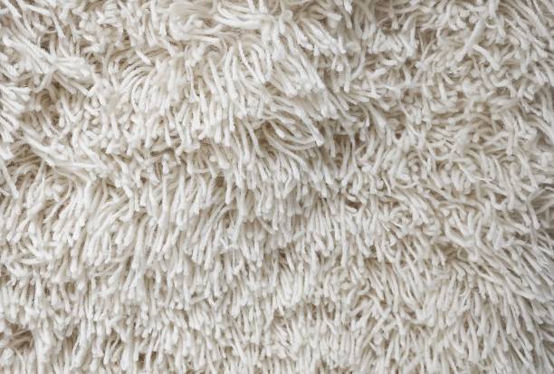 istock Detail of White Fluffy Fabric Texture Background 891048394