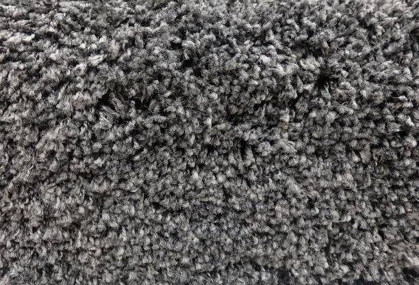 istock Detail of Black Fluffy Fabric Texture Background 891048600