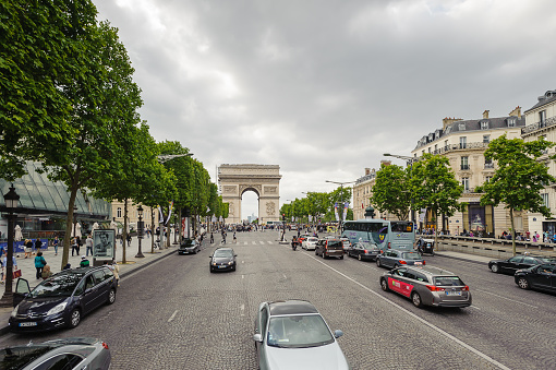 PARIS, FRANCE - JUN 17, 2014: Arc de Triomphe de l'Etoile in Paris, France. It's one of the most important monuments in Paris