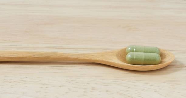 Wooden Spoon with Two Hebal Capsule Pills