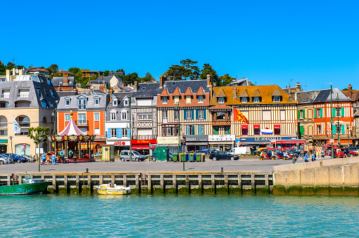 TROUVILLE, FRANCE - JUN 7, 2015:  Touques River and Trouville, Normandy, France. Trouville is a village of fishermen and a popular tourist attraction in Normandy