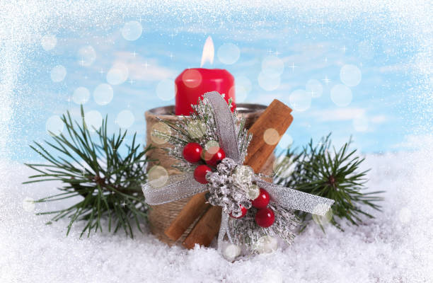 istock New Year greeting card with a candle and branches 891057276
