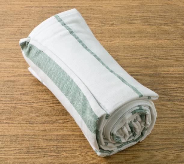 istock White and Green Kitchen Towel on Wooden Table 891057710