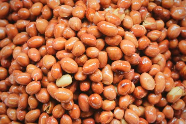 istock Pile of Deep Fried and Salted Peanuts 891057916