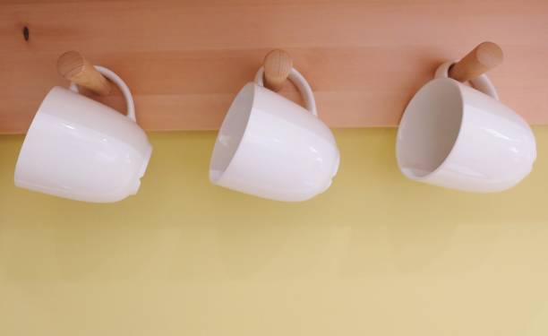 istock Three Empty Cup of Coffee Hanging on The Wall 891060156