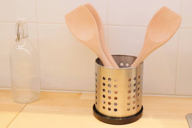 istock Two Wooden Kitchen Spatula in A Bucket 891060966