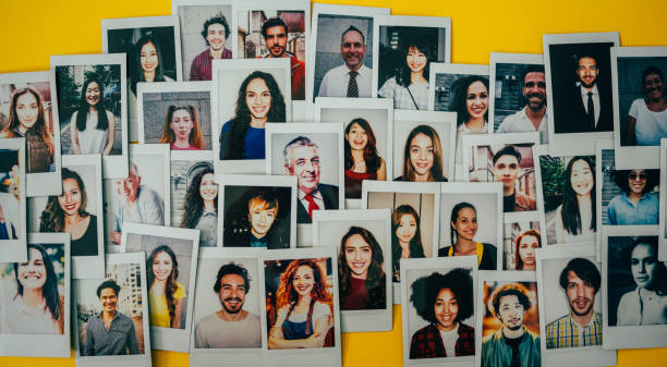 Human resources Polaroid photos of different people hanged on the wall. crowdsourcing stock pictures, royalty-free photos & images
