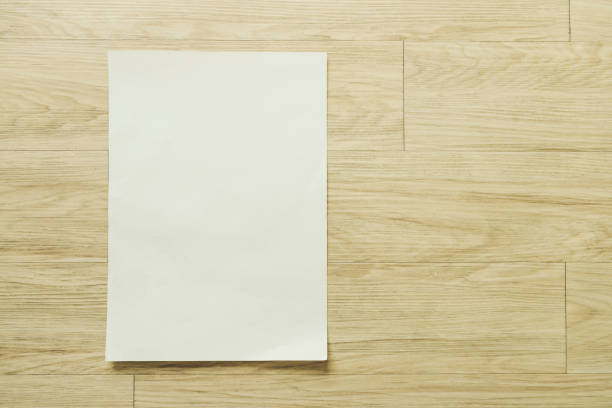 istock Mock up flyer pamphlet brochure design A4 size paper layout space for template illustration mockup, flat lay on wood table from top view 891102896