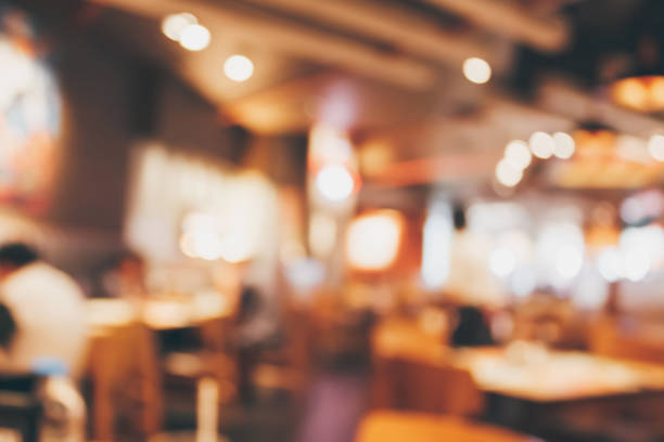 istock Restaurant cafe or coffee shop interior with people abstract blur background 891103062