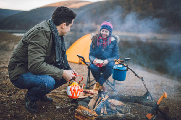 istock Campers next to the campfire preparing food 891107798