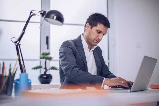 istock Businessman working on laptop 891107842