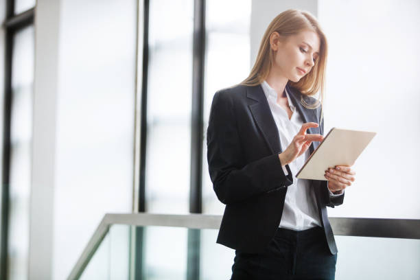 istock Young Busineswoman usin digital tablet 891115928