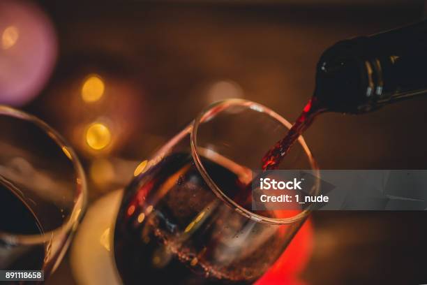 Red Wine Pouring Into Glass Stock Photo - Download Image Now - Night, Red Wine, Wineglass