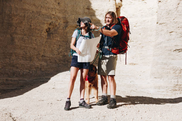 istock Couple hiking together in the wilderness 891123698