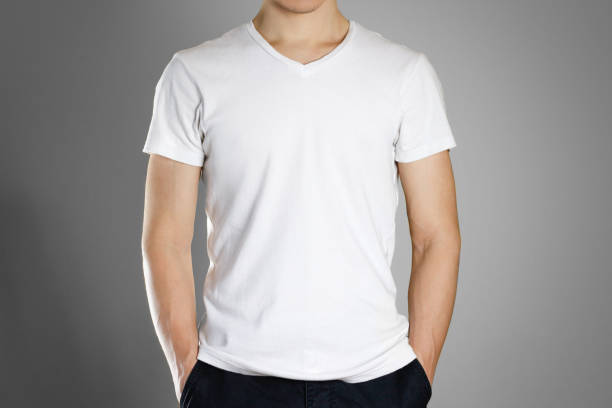 istock Man in blank white t-shirt. Front. Ready for your design. Hands in his pockets. Closeup. Isolated 891129012