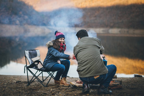 istock Campers next to the campfire preparing food 891150788