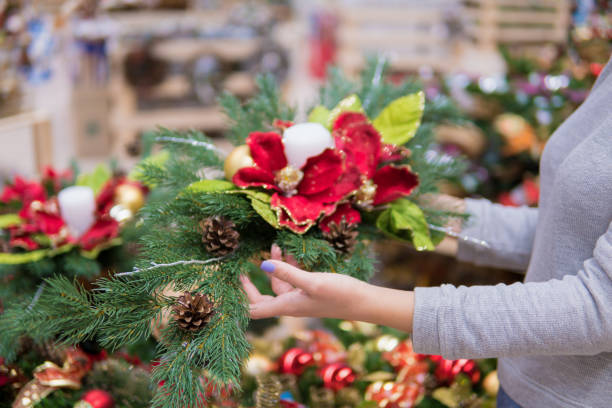istock customer woman choosing Christmas decorations 891156474