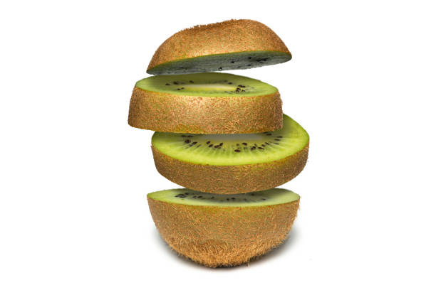 istock Levity kiwi. Sliced kiwi isolated on white background. Flying fruit floating in the air. 891169940