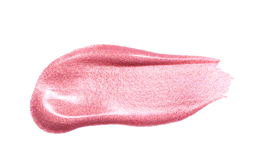 Lip gloss sample isolated on white. Smudged pink lipgloss. Makeup product sample