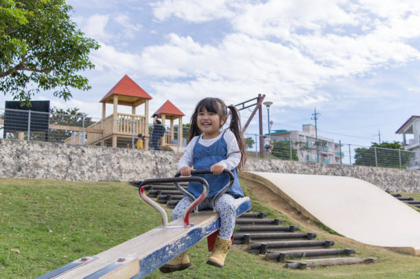 istock Father and girl playing in the park 891172846