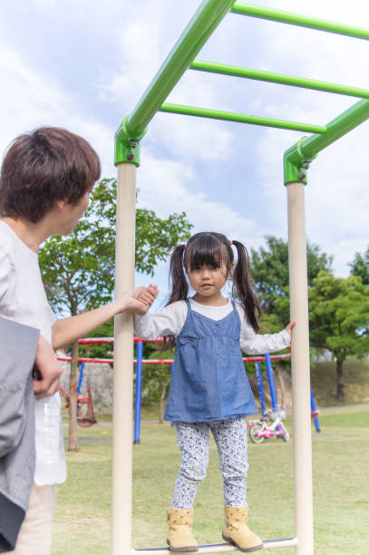 istock Father and girl playing in the park 891172862