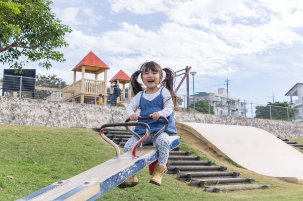 istock Father and girl playing in the park 891175444