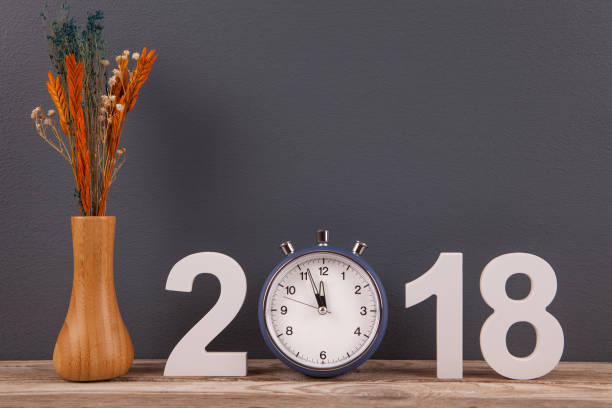 istock New Year 2018 Concepts with Blue Clock on Desk 891180858