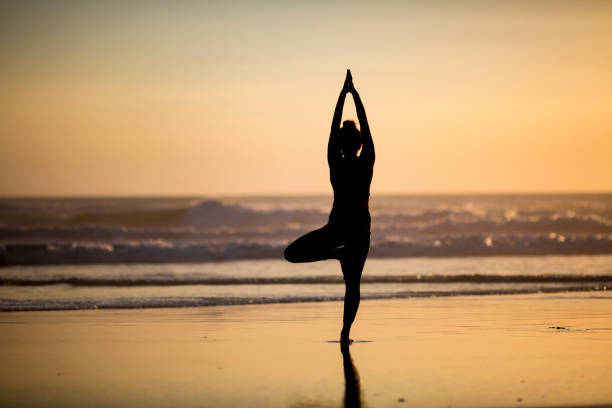 istock Woman doing meditation at sunset 891180932