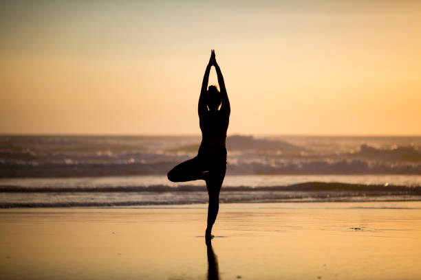 istock Woman doing meditation at sunset 891180942