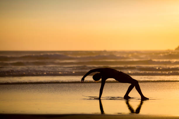 istock Woman doing meditation at sunset 891181182