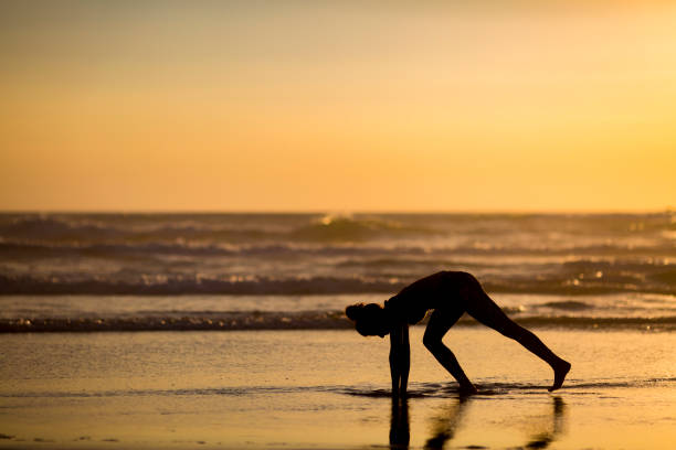 istock Woman doing meditation at sunset 891181194