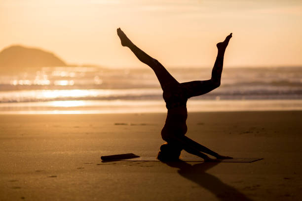 istock Woman doing meditation at sunset 891181252