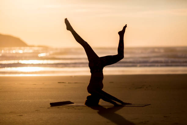 istock Woman doing meditation at sunset 891181264