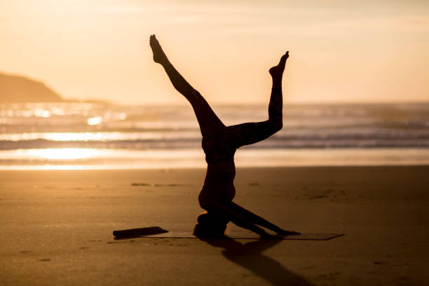 istock Woman doing meditation at sunset 891181270
