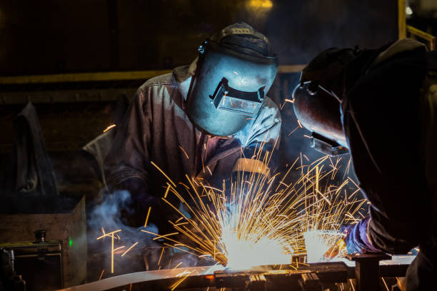 istock Workers are welding in car factory 891187168