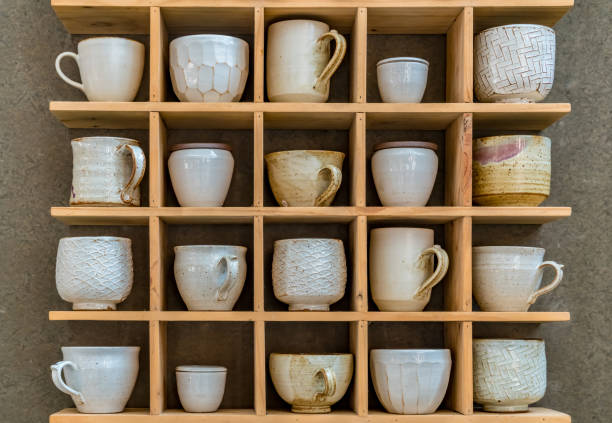 istock Ceramic cup on wooden shelves 891187212