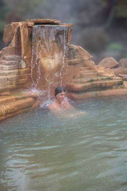 rendere grazie in acqua calda - waterfall zen like women meditating foto e immagini stock