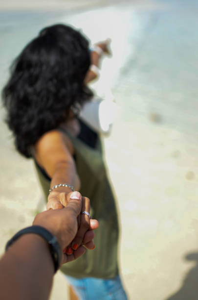 istock Girl Holding someones hand and pointing at something 891195076