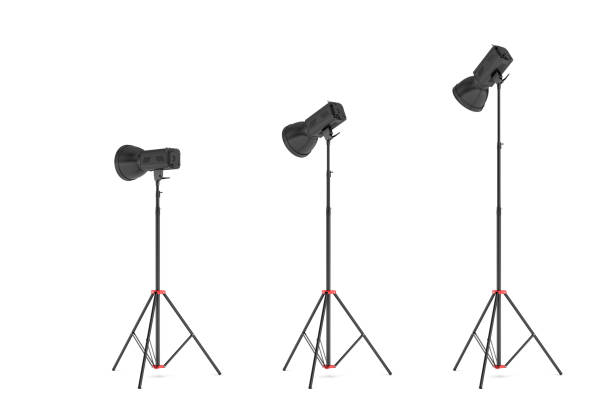 istock 3d rendering of three lights with reflectors with the head turned down and up 891207392