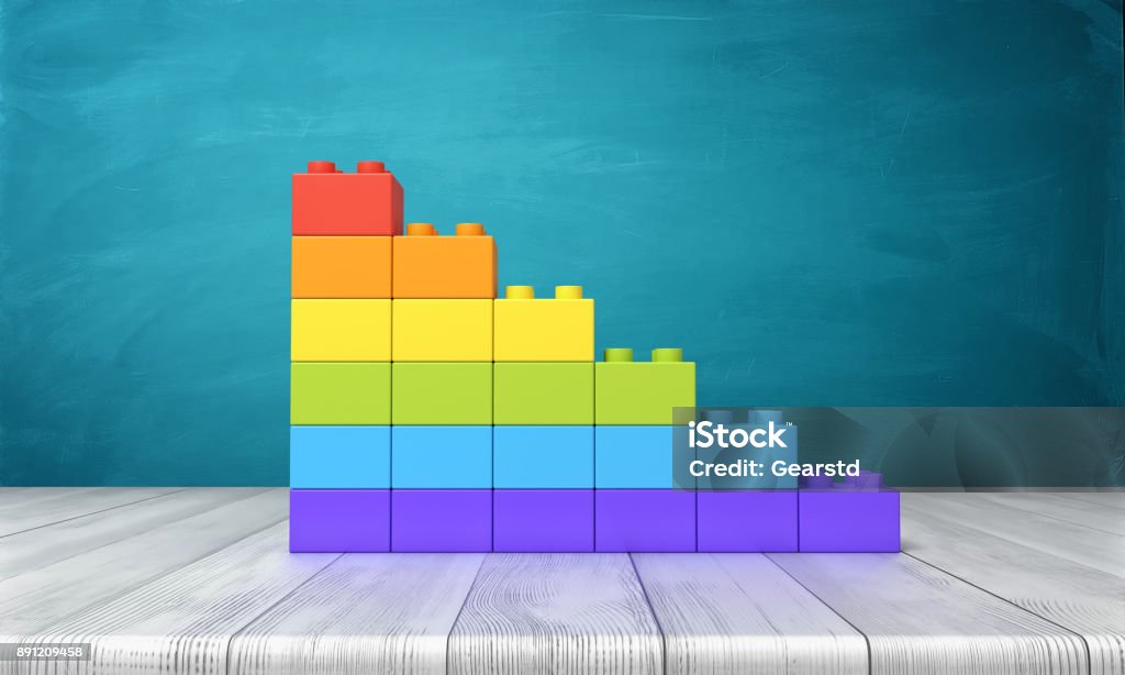 3d rendering of a toy building blocks arranged into rainbow colored stars on top of a wooden desk 3d rendering of a toy building blocks arranged into rainbow colored stars on top of a wooden desk. Unity and difference. Uniqueness. Uncommon traits. Toy Block Stock Photo