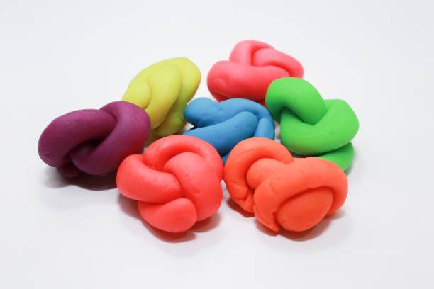 istock colorful playdough close up image on white background. 891209650