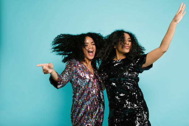 istock Two happy women having fun, dancing together 891219806