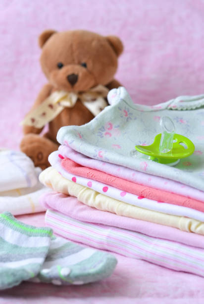 istock New clothes for the newborn, dummy and bear. 891220088